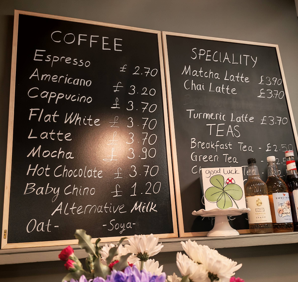 The handwritten coffee and speciality menu board in the cafe